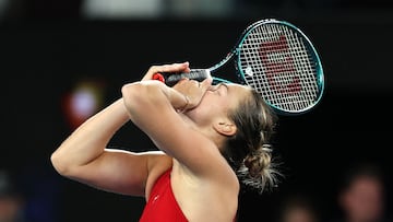 Belarus' Aryna Sabalenka celebrates victory against China's Zheng Qinwen during their women's singles final match on day 14 of the Australian Open tennis tournament in Melbourne on January 27, 2024. (Photo by Martin KEEP / AFP) / -- IMAGE RESTRICTED TO EDITORIAL USE - STRICTLY NO COMMERCIAL USE --