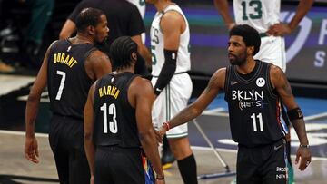 Brooklyn Nets guard James Harden, Kyrie Irving (11) and forward Kevin Durant react after a basket against the Boston Celtics in the first half of Game 5 during an NBA basketball first-round playoff series, Tuesday, June 1, 2021, in New York. (AP Photo/Adam Hunger)