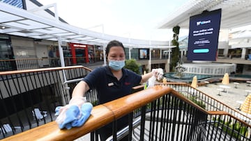 SYDNEY, AUSTRALIA - OCTOBER 08: A member of the cleaning services team at Westfield Warringah Mall cleans a staircase on October 08, 2021 in Sydney, Australia. COVID-19 restrictions will ease across NSW from Monday, 11 October after the state passed its 70 per cent double vaccination target. Under the state government's Reopening NSW Roadmap, from Monday people who are fully vaccinated will be permitted to have 10 visitors in their homes, and outdoor gatherings of up to 20 people will be permitted. Hospitality, retail stores, gyms and hairdressers will reopen, as well as cinemas, theatres, museums and galleries. Indoor pools will reopen and up to 500 people will be able to attend ticketed outdoor events. Weddings and funerals will be able to have up to 100 people provided all adults have received two doses of a COVID-19 vaccine. Churches and places of worship will be permitted to open with no singing. Restrictions will ease further in NSW once the state reaches its next vaccination milestone of 80 per cent of people having received two doses of a COVID-19 vaccine. (Photo by James D. Morgan/Getty Images)