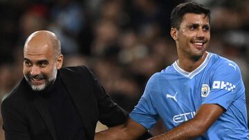 Manchester City's Spanish manager Pep Guardiola congratulates Manchester City's Spanish midfielder #16 Rodri as he leaves the pitch during the UEFA Champions League Group G football match between Manchester City and FC Crvena Zvezda (Red Star Belgrade) at the Etihad Stadium in Manchester, north west England, on September 19, 2023. (Photo by Oli SCARFF / AFP)