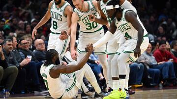 CLEVELAND, OHIO - MARCH 05: Derrick White #9 Sam Hauser #30 Al Horford #42 and Jrue Holiday #4 of the Boston Celtics help Jaylen Brown #7 of the Boston Celtics to his feet during the third quarter against the Cleveland Cavaliers at Rocket Mortgage Fieldhouse on March 05, 2024 in Cleveland, Ohio. The Cavaliers defeated the Celtics 105-104. NOTE TO USER: User expressly acknowledges and agrees that, by downloading and or using this photograph, User is consenting to the terms and conditions of the Getty Images License Agreement.   Jason Miller/Getty Images/AFP (Photo by Jason Miller / GETTY IMAGES NORTH AMERICA / Getty Images via AFP)