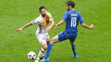 PARIS, FRANCE - JUNE 27: Nolito of Spain is challenged by Marco Parolo of Italy during the UEFA EURO 2016 round of 16 match between Italy and Spain at Stade de France on June 27, 2016 in Paris, France. (Photo by Clive Rose/Getty Images)