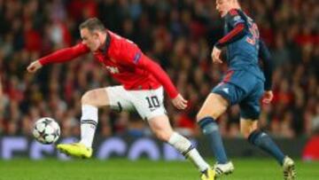 Kroos (dcha.) pugna con Rooney en la ida en Old Trafford.