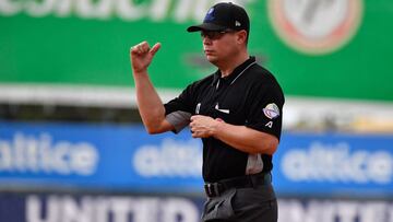 A first base umpire tosses out during a Caribbean Series baseball match between Mexico and Panama at the Quisqueya Juan Marichal stadium in Santo Domingo, on February 1, 2022. - The 2022 Caribbean Series, which finish Thursday, inaugurated their 'Rep