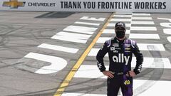 LONG POND, PENNSYLVANIA - JUNE 28: Jimmie Johnson, driver of the #48 Ally Chevrolet, poses on the Start/Finish line to show support for front line workers prior to the NASCAR Cup Series Pocono 350 at Pocono Raceway on June 28, 2020 in Long Pond, Pennsylva