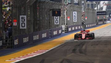 Ferrari's German driver Sebastian Vettel drives during the third practice session ahead of the Singapore Formula One Grand Prix at the Marina Bay Street Circuit in Singapore on September 15, 2018. (Photo by Jewel SAMAD / AFP)