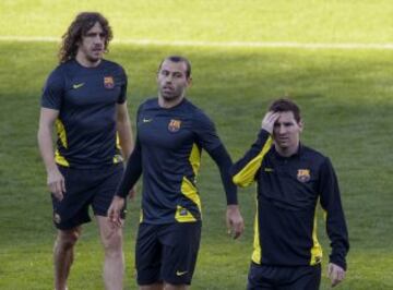 Carles Puyol, Javier Mascherano y Lionel Messi.