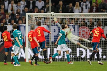 Thomas Müller (second left) beats David de Gea from range in Friday's international friendly in Düsseldorf.