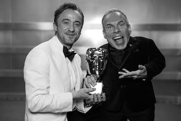 Tom Felton y Warwick Davis durante los premios BAFTA 2025.