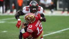 SANTA CLARA, CALIFORNIA - DECEMBER 11: Keanu Neal #22 of the Tampa Bay Buccaneers tackles Brock Purdy #13 of the San Francisco 49ers during the first half of the game at Levi's Stadium on December 11, 2022 in Santa Clara, California.   Lachlan Cunningham/Getty Images/AFP (Photo by Lachlan Cunningham / GETTY IMAGES NORTH AMERICA / Getty Images via AFP)