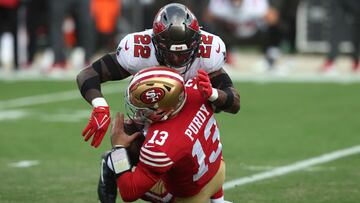 SANTA CLARA, CALIFORNIA - DECEMBER 11: Keanu Neal #22 of the Tampa Bay Buccaneers tackles Brock Purdy #13 of the San Francisco 49ers during the first half of the game at Levi's Stadium on December 11, 2022 in Santa Clara, California. Lachlan Cunningham/Getty Images/AFP (Photo by Lachlan Cunningham / GETTY IMAGES NORTH AMERICA / Getty Images via AFP)