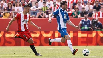 Granell y V&iacute;ctor S&aacute;nchez, jugadores del Girona y del Espanyol durante un partido. 