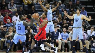 Nov 27, 2018; Memphis, TN, USA; Toronto Raptors forward Kawhi Leonard (2) drives to the basket as Memphis Grizzlies forward JaMychal Green (0) guard Wayne Selden Jr (7) and forward Omri Casspi (18) defend at FedExForum. Toronto won 122-114. Mandatory Credit: Nelson Chenault-USA TODAY Sports