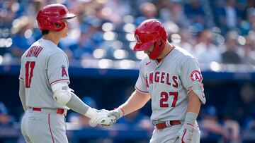 Los Angeles Angels center fielder Mike Trout (27) hits a home run and celebrates with Los Angeles Angels designated hitter Shohei Ohtani (17) against the Toronto Blue Jays during the ninth inning at Rogers Centre.