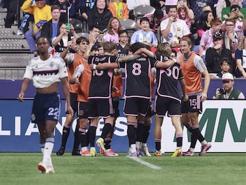 VANCOUVER, CANADA - MAY 25: Ali Ahmed #22 of the Vancouver Whitecaps walks away dejected as Leonardo Campana #8 of Inter Miami CF is congratulated by teammates after scoring the winning goal during the second half of their MLS match at BC Place on May 25, 2024 in Vancouver, British Columbia, Canada. Inter Miami CF won 2-1. Jeff Vinnick/Getty Images/AFP (Photo by JEFF VINNICK / GETTY IMAGES NORTH AMERICA / Getty Images via AFP)