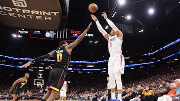 PHOENIX, ARIZONA - APRIL 16: Russell Westbrook #0 of the LA Clippers puts up a three-point shot over Torrey Craig #0 of the Phoenix Suns during the first half Game One of the Western Conference First Round Playoffs at Footprint Center on April 16, 2023 in Phoenix, Arizona. NOTE TO USER: User expressly acknowledges and agrees that, by downloading and or using this photograph, User is consenting to the terms and conditions of the Getty Images License Agreement. Christian Petersen/Getty Images/AFP (Photo by Christian Petersen / GETTY IMAGES NORTH AMERICA / Getty Images via AFP)