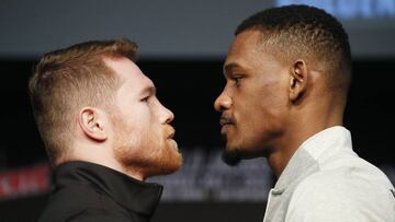 Canelo Alvarez, left, and Daniel Jacobs pose for photographers at a news conference for their middleweight title boxing match Wednesday, May 1, 2019, in Las Vegas. The two are scheduled to fight Saturday in Las Vegas. (AP Photo/John Locher)