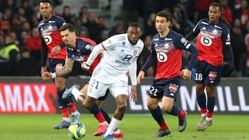 Soccer Football - Ligue 1 - Lille v Olympique Lyonnais - Stade Pierre-Mauroy, Lille, France - March 8, 2020 Olympique Lyonnais' Karl Toko Ekambi in action with Lille's Jose Fonte and Benjamin Andre REUTERS/Francois Walschaerts