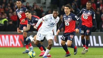 Soccer Football - Ligue 1 - Lille v Olympique Lyonnais - Stade Pierre-Mauroy, Lille, France - March 8, 2020   Olympique Lyonnais&#039; Karl Toko Ekambi  in action with Lille&#039;s Jose Fonte and Benjamin Andre    REUTERS/Francois Walschaerts