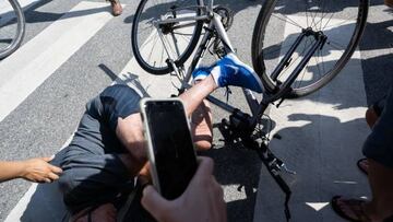 US President Joe Biden falls off his bicycle as he approaches well-wishers following a bike ride at Gordon's Pond State Park in Rehoboth Beach, Delaware, on June 18, 2022. - Biden took a tumble as he was riding his bicycle Saturday morning, but was unhurt. (Photo by SAUL LOEB / AFP) (Photo by SAUL LOEB/AFP via Getty Images)