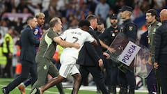 Police storm the pitch after fiery El Clásico brawl between Real Madrid and Barcelona