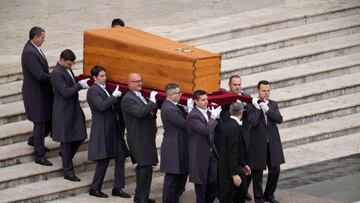 VATICAN CITY, VATICAN - JANUARY 05: Pallbearers carry the coffin of Pope Emeritus Benedict XVI at the start of his funeral mass at St. Peter's square on January 5, 2023 in Vatican City, Vatican. Former Pope Benedict XVI, who served as head of the Catholic Church from 19 April 2005 until his resignation on 28 February 2013, died on 31 December 2022 aged 95 at the Mater Ecclesiae Monastery in Vatican City. Over 135,000 people paid their tributes on the first two days of the late pontiff's lying in state at St. Peter's Basilica. (Photo by Christopher Furlong/Getty Images)