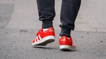 PARIS, FRANCE - MAY 14: A passerby wears red Adidas sneakers shoes, in the streets of Paris, on May 14, 2020 in Paris, France. (Photo by Edward Berthelot/Getty Images)