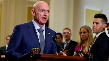 FILE PHOTO: U.S. Sen. Mark Kelly (D-AZ) looks at reporters during a press conference following the weekly Senate caucus luncheons on Capitol Hill in Washington, U.S., April 9, 2024. REUTERS/Amanda Andrade-Rhoades/File Photo