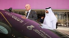 29 March 2022, Qatar, Doha: FIFA President Gianni Infantino (L) gets into his waiting vehicle after a tour of the Doha Exhibition &amp; Convention Center (DECC) in the West Bay district. The DECC will host the Fifa Congress on March 31 and the group draw 