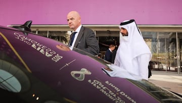 29 March 2022, Qatar, Doha: FIFA President Gianni Infantino (L) gets into his waiting vehicle after a tour of the Doha Exhibition &amp; Convention Center (DECC) in the West Bay district. The DECC will host the Fifa Congress on March 31 and the group draw 