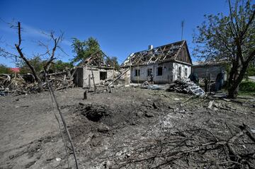 Damaged houses are seen after the 18 missiles hit the civil settlements of Komyshuvakha, Ukraine