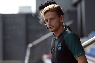 Barcelona's Croatian midfielder Ivan Rakitic arrives for a training session at the Sports Center FC Barcelona Joan Gamper in Sant Joan Despi, near Barcelona on September 12, 2016, on the eve of their Champions League football match against Celtic CF. / AF