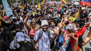 Juan Esteban Murillo, 21, university student, dancer and juvenile leader, takes part in a protest against the government in Medellin, Colombia, on May 12, 2021. - A former guerrilla, an indigenous guard and a student leader are some of the faces seen in the protests taking place against the Colombian government, which were triggered by a now abandoned tax reform bill. (Photo by JOAQUIN SARMIENTO / AFP)