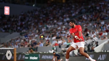 Serbia's Novak Djokovic plays a backhand return to Austria's Filip Misolic during their men's singles match on day 7 of the French Open tennis tournament on Court Philippe-Chatrier at the Roland-Garros Complex in Paris on May 31, 2025. (Photo by Anne-Christine POUJOULAT / AFP)