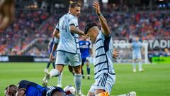 Jul 23, 2023; Cincinnati, OH, USA;  FC Cincinnati defender Yerson Mosquera, left, reacts after he collides with Sporting Kansas City forward Alan Pulido in the first half at TQL Stadium. Mandatory Credit: Aaron Doster-USA TODAY Sports