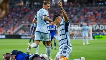 Jul 23, 2023; Cincinnati, OH, USA; FC Cincinnati defender Yerson Mosquera, left, reacts after he collides with Sporting Kansas City forward Alan Pulido in the first half at TQL Stadium. Mandatory Credit: Aaron Doster-USA TODAY Sports