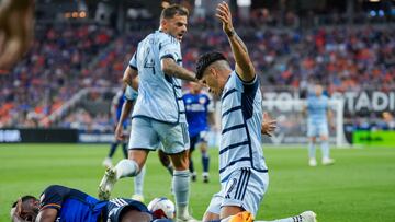 Jul 23, 2023; Cincinnati, OH, USA;  FC Cincinnati defender Yerson Mosquera, left, reacts after he collides with Sporting Kansas City forward Alan Pulido in the first half at TQL Stadium. Mandatory Credit: Aaron Doster-USA TODAY Sports