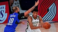 Aug 29, 2020; Lake Buena Vista, Florida, USA; Milwaukee Bucks forward Giannis Antetokounmpo (34) drives to the basket against Orlando Magic guard Evan Fournier (10) during the fourth quarter in game five of the first round of the 2020 NBA Playoffs at AdventHealth Arena. Mandatory Credit: Kim Klement-USA TODAY Sports