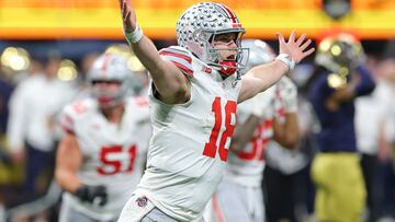 ATLANTA, GEORGIA - JANUARY 20: Will Howard #18 of the Ohio State Buckeyes reacts after throwing a pass for a first down against the Notre Dame Fighting Irish during the fourth quarter in the 2025 CFP National Championship at the Mercedes-Benz Stadium on January 20, 2025 in Atlanta, Georgia. Kevin C. Cox/Getty Images/AFP (Photo by Kevin C. Cox / GETTY IMAGES NORTH AMERICA / Getty Images via AFP)