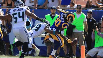 LOS ANGELES, CA - OCTOBER 08: Todd Gurley #30 of the Los Angeles Rams runs a 12-yard touchdown which was overturned and ruled a fumble that went out of bounds in the end zone during the game against the Seattle Seahawks at the Los Angeles Memorial Coliseum on October 8, 2017 in Los Angeles, California. Sean M. Haffey/Getty Images/AFP
== FOR NEWSPAPERS, INTERNET, TELCOS & TELEVISION USE ONLY ==