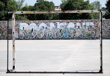 The goal of a football pitch frames a graffiti reading "Rocafonda", the name of the neighbourhood where Spain's forward Lamine Yamal grew up, in Mataro, 35km from Barcelona, on July 11, 2024. (Photo by Josep LAGO / AFP)