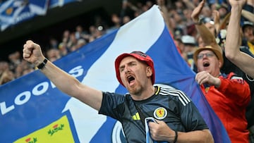A Scottish supporter gestures ahead of the UEFA Euro 2024 Group A football match between Germany and Scotland at the Munich Football Arena in Munich on June 14, 2024. (Photo by Miguel MEDINA / AFP)