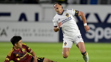 May 10, 2023; Carson, CA, USA; Los Angeles Galaxy forward Javier Hernandez (14) and Seattle Sounders midfielder Sota Kitahara (77) get tangled up as they go for the ball in the first half at Dignity Health Sports Park. Mandatory Credit: Jayne Kamin-Oncea-USA TODAY Sports