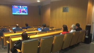 Filipe Luis watches second half from Camp Nou press room