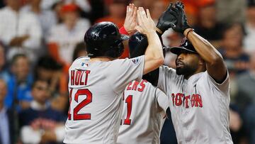 HOUSTON, TX - OCTOBER 16: Jackie Bradley Jr. #19 of the Boston Red Sox celebrates with Brock Holt #12 after hitting a grand slam home run in the eighth inning against the Houston Astros during Game Three of the American League Championship Series at Minut