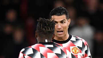 Manchester United's Portuguese striker Cristiano Ronaldo (R) speaks to Manchester United's Brazilian midfielder Fred (L) during the warm up prior to the English Premier League football match between Manchester United and Tottenham Hotspur at Old Trafford in Manchester, north west England, on October 19, 2022. (Photo by Oli SCARFF / AFP) / RESTRICTED TO EDITORIAL USE. No use with unauthorized audio, video, data, fixture lists, club/league logos or 'live' services. Online in-match use limited to 120 images. An additional 40 images may be used in extra time. No video emulation. Social media in-match use limited to 120 images. An additional 40 images may be used in extra time. No use in betting publications, games or single club/league/player publications. / 