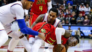 Jan 29, 2017; Atlanta, GA, USA;  Atlanta Hawks guard Dennis Schroder (17) gets tangled up with New York Knicks forward Carmelo Anthony (7) and guard Brandon Jennings (3) scrambling for a loose ball during the second overtime at Philips Arena. Mandatory Credit: Butch Dill-USA TODAY Sports