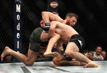 LAS VEGAS, NV - OCTOBER 06: Conor McGregor of Ireland tackles Khabib Nurmagomedov of Russia in their UFC lightweight championship bout during the UFC 229 event inside T-Mobile Arena on October 6, 2018 in Las Vegas, Nevada.   Harry How/Getty Images/AFP
==