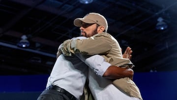 Eminem hugs former U.S. President Barack Obama during a campaign event for Democratic presidential nominee and U.S. Vice President Kamala Harris, during the first week of early voting in Detroit, Michigan, U.S. October 22, 2024. REUTERS/Emily Elconin