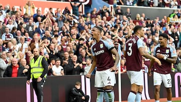 Aston Villa's English defender #04 Ezri Konsa (C) celebrates after scoring his team's second goal during the English Premier League football match between Aston Villa and Wolverhampton Wanderers at Villa Park in Birmingham, central England on September 21, 2024. (Photo by JUSTIN TALLIS / AFP) / RESTRICTED TO EDITORIAL USE. No use with unauthorized audio, video, data, fixture lists, club/league logos or 'live' services. Online in-match use limited to 120 images. An additional 40 images may be used in extra time. No video emulation. Social media in-match use limited to 120 images. An additional 40 images may be used in extra time. No use in betting publications, games or single club/league/player publications. /